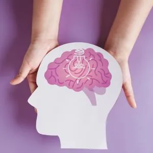 image of a brain with a light bulb symbolizing brain health